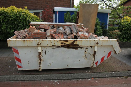 Construction site with waste removal trucks in Hendon
