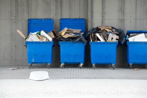 Various sizes of skips available for hire in Hendon on a residential site.