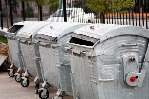 Professional service team delivering a lockable skip